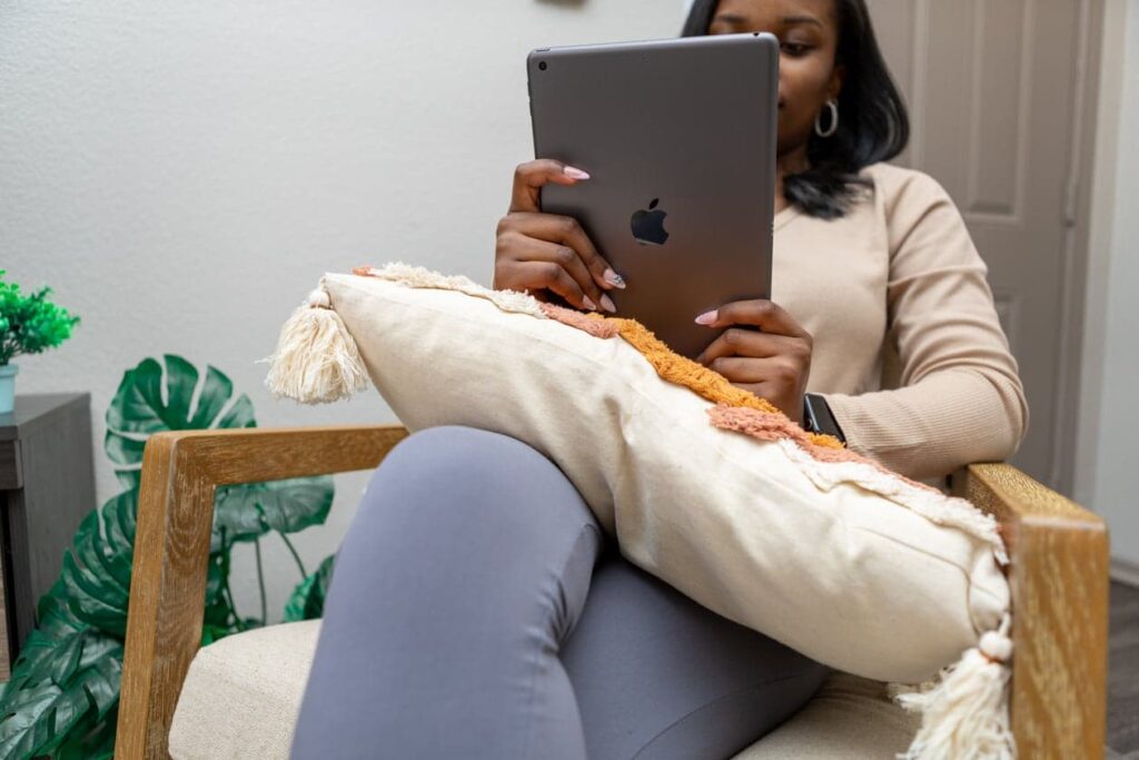 Black woman holding tablet