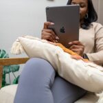 Black woman holding tablet